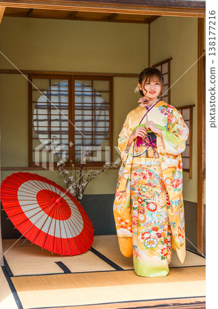 A young Japanese woman wearing a furisode kimono in a Japanese-style room (coming-of-age ceremony, 20th birthday celebration) A young Japanese woman wearing a furisode kimono in a Japanese-style room (coming-of-age ceremony, 20th birthday celebration) 138177216