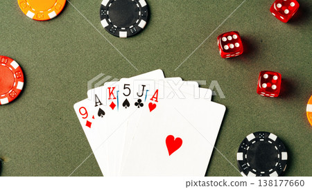 Cards and chips are placed on the table during a game night with friends in a home setting Cards and chips are placed on the table during a game night with friends in a home setting 138177660