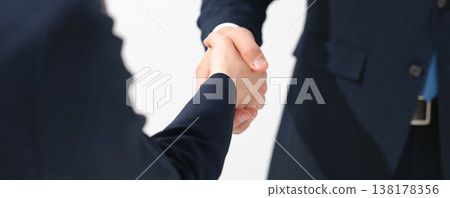Business person shaking hands 138178356