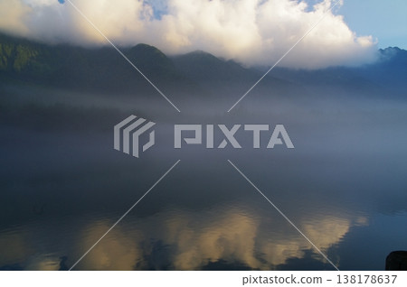 In early summer in Kamikochi, Matsumoto City, Nagano Prefecture, the fresh greenery is dazzling amidst the lingering snow on the mountains. 138178637