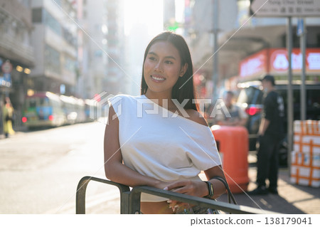 Young Thai Woman Tourist on Hong Kong Street Young Thai Woman Tourist on Hong Kong Street 138179041
