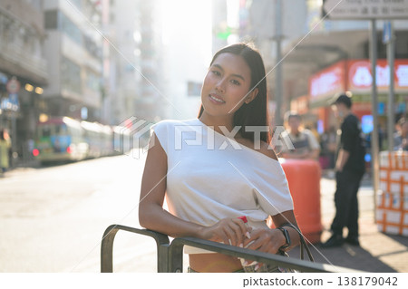 Young Thai Woman Tourist on Hong Kong Street Young Thai Woman Tourist on Hong Kong Street 138179042