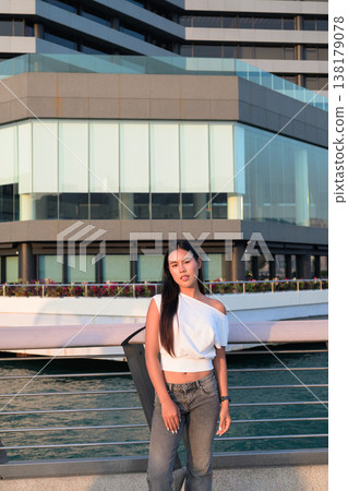 Smiling Thai Woman Tourist at Hong Kong Victoria Harbour Smiling Thai Woman Tourist at Hong Kong Victoria Harbour 138179078