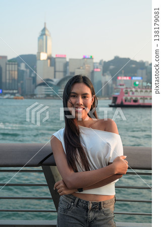 Smiling Thai Woman Tourist at Hong Kong Victoria Harbour Smiling Thai Woman Tourist at Hong Kong Victoria Harbour 138179081