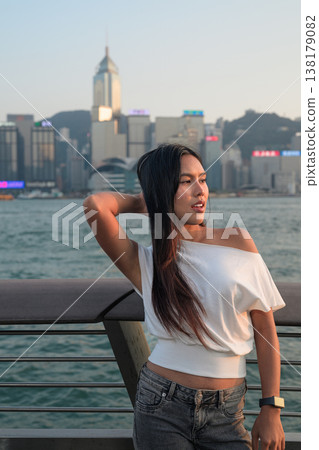 Smiling Thai Woman Tourist at Hong Kong Victoria Harbour Smiling Thai Woman Tourist at Hong Kong Victoria Harbour 138179082
