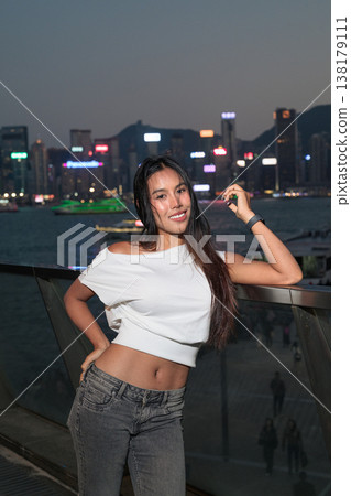 Thai Woman Tourist at Hong Kong Night Skyline 138179111