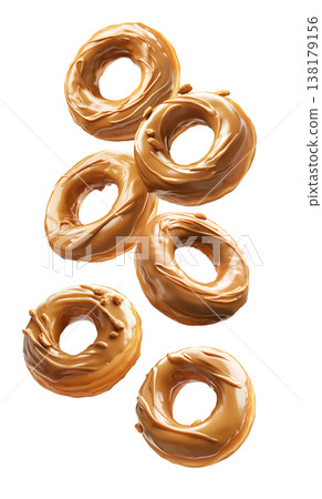 Multiple caramel glazed donuts scattered in a seamless pattern, isolated on white background, concept of dessert Multiple caramel glazed donuts scattered in a seamless pattern, isolated on white background, concept of dessert 138179156