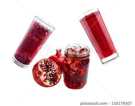 Pomegranate juice jars with ice and fruits isolated on white background, concept of natural freshness Pomegranate juice jars with ice and fruits isolated on white background, concept of natural freshness 138179307