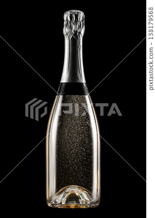 Champagne bottle with rising bubbles and silver foil on black backdrop with clipping path, symbolizing celebration and elegance 138179568