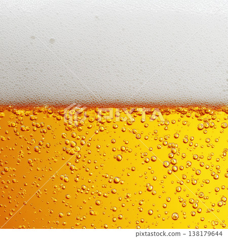 Closeup of beer with rising bubbles and foam on a white background showing freshness concept Closeup of beer with rising bubbles and foam on a white background showing freshness concept 138179644