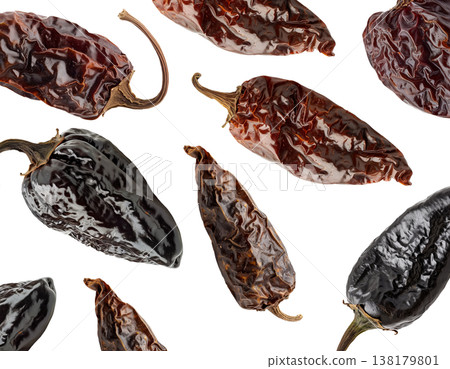 Dried chili peppers scattered and isolated on white background, spicy food concept, showcasing culinary ingredients texture 138179801
