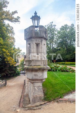 A historic stone lamppost in the castle park A historic stone lamppost in the castle park 138180135