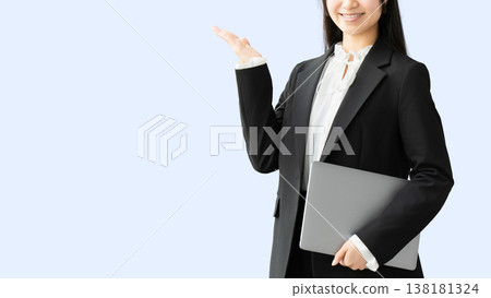 A woman/businesswoman giving a tour with a laptop. A woman/businesswoman giving a tour with a laptop. 138181324