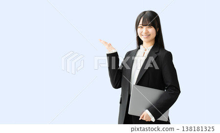 A woman/businesswoman giving a tour with a laptop. A woman/businesswoman giving a tour with a laptop. 138181325