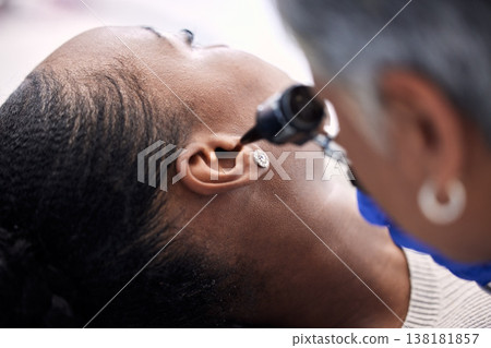 Healthcare, doctor or woman for hearing consultation from infection or ear problem with otoscope at clinic. Otolaryngology, professional and black person for medical exam, test or patient for checkup Healthcare, doctor or woman for hearing consultation from infection or ear problem with otoscope at clinic. Otolaryngology, professional and black person for medical exam, test or patient for checkup 138181857