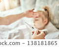 Parent, hands and thermometer for child fever in bed from cold, sick or flu virus at home. Closeup of person checking kid with illness for temperature or measurement in bedroom or rest at house 138181865