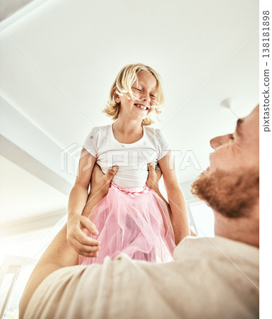 Family, kids and a father carrying his girl daughter in the living room of their home together closeup. Smile, love or children with a happy young kid and her man parent having fun in their house 138181898