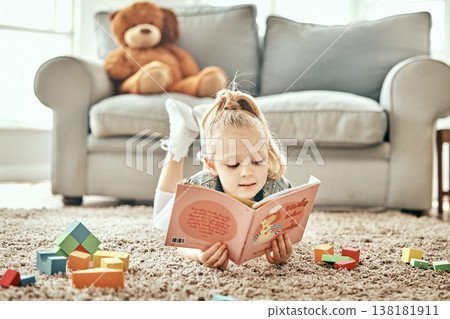 Learning, floor and child reading a book for education, fiction or studying in a home living room. Relax, carpet and a young girl kid with a story or fairytale in a house for playing, fun and curious Learning, floor and child reading a book for education, fiction or studying in a home living room. Relax, carpet and a young girl kid with a story or fairytale in a house for playing, fun and curious 138181911