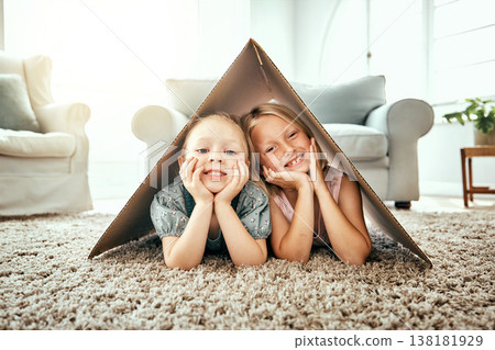Portrait, children and cardboard for insurance with girl sisters on the floor of the living room at home. Security. family or kids and young siblings on a carpet in their house for safety with flare Portrait, children and cardboard for insurance with girl sisters on the floor of the living room at home. Security. family or kids and young siblings on a carpet in their house for safety with flare 138181929