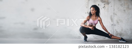 Banner, mockup space and woman with fitness doing exercise or workout for wellness and health by wall. Athlete, ready and strong person prepare for training or stretching leg muscle for body balance 138182123