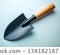 Soil preparation. Black shovel on a white background. Garden tools. 138182187