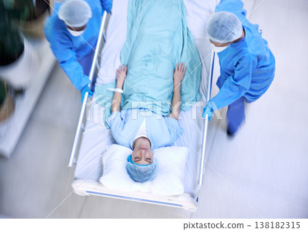 Doctors, team and hurry with bed in hospital for medical emergency, surgery operation or helping from above. Healthcare group running fast in rush, motion blur and urgent patient assessment in clinic 138182315