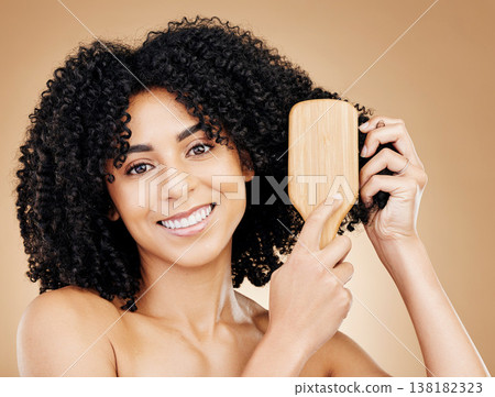 Woman, portrait and brush hair, curly with shine and beauty, smile for salon treatment and strong texture on studio background. Face, skin and growth, haircare and cosmetology with cosmetic tools Woman, portrait and brush hair, curly with shine and beauty, smile for salon treatment and strong texture on studio background. Face, skin and growth, haircare and cosmetology with cosmetic tools 138182323