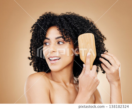 Hair, woman brush curls and beauty, routine or treatment for shine, cosmetic care and smile on studio background. Wellness, haircare and growth with strong texture and bamboo tools, volume and afro 138182324