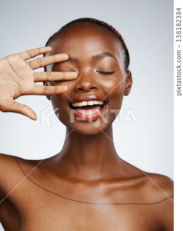 Hand of black woman, smile or natural beauty aesthetic for wellness in studio with pride, shine or glow. Dermatology, clean face or happy African girl model with skincare results on white background Hand of black woman, smile or natural beauty aesthetic for wellness in studio with pride, shine or glow. Dermatology, clean face or happy African girl model with skincare results on white background 138182384