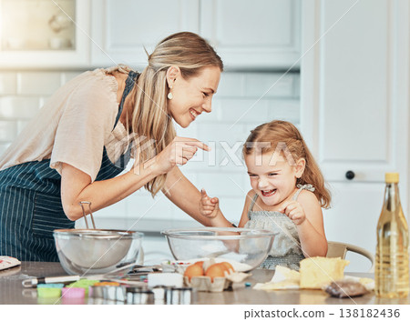 Mom, girl kid and teaching for baking, development and laugh with bonding, love and care in family home. Cooking, funny mother and daughter with bowl, flour or eggs on table, kitchen or help for food Mom, girl kid and teaching for baking, development and laugh with bonding, love and care in family home. Cooking, funny mother and daughter with bowl, flour or eggs on table, kitchen or help for food 138182436