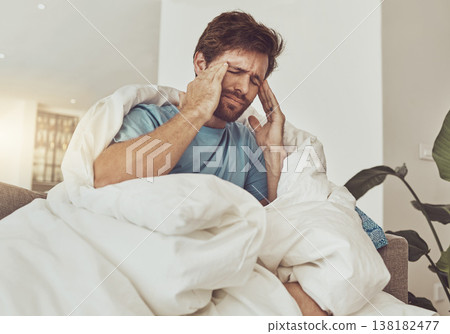 Stress, headache and sick man on a sofa with burnout, vertigo or pain from insomnia at home. Anxiety, migraine and male person in a lounge with temple massage for dizziness, congestion or head cold 138182477