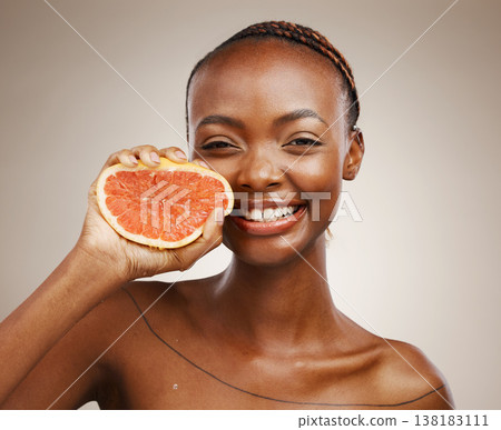 Black woman, skincare and smile with grapefruit, beauty and cosmetics for healthy skin, vitamin c and facial. Portrait, wellness and glow for dermatology, natural and vegan with citrus, clean or face 138183111