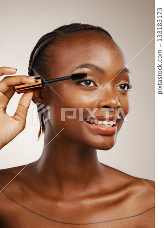 Mascara, happy woman and makeup in studio for beauty, cosmetics and smile on brown background. African model, makeover and brush lashes for skincare application, aesthetic tools and eyelash extension Mascara, happy woman and makeup in studio for beauty, cosmetics and smile on brown background. African model, makeover and brush lashes for skincare application, aesthetic tools and eyelash extension 138183173
