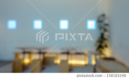 Softly blurred minimalist cafe interior with blue window glow abstract background 138183248