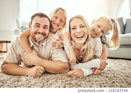 Happy, smile and portrait of family in the living room bonding, hugging and relaxing together. Happiness, love and girl children laying with parents from Australia on floor in lounge at modern home. Happy, smile and portrait of family in the living room bonding, hugging and relaxing together. Happiness, love and girl children laying with parents from Australia on floor in lounge at modern home. 138183336