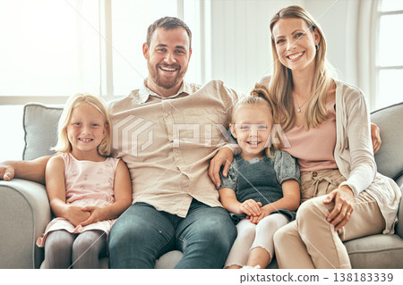 Happy family, portrait and relax on living room sofa for bonding, weekend or holiday together at home. Mother, father and children smile, hug and sitting on couch for summer break or rest at house 138183339