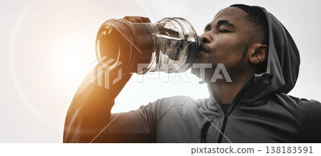 Black man, fitness and drinking water on break for hydration, workout or exercise in motivation. Banner of African male person with sports or mineral drink for natural sustainability or recovery Black man, fitness and drinking water on break for hydration, workout or exercise in motivation. Banner of African male person with sports or mineral drink for natural sustainability or recovery 138183591