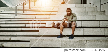 Outdoor, fitness and black man with smartphone, stairs and online reading with social media, connection and relax. African person, healthy runner and athlete with cellphone, digital app and network 138183597