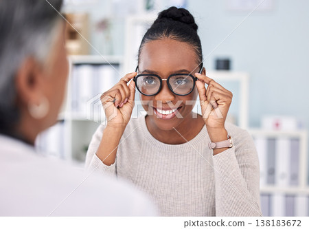 Eye care, glasses and black woman with optometrist, vision and healthcare with wellness and choice at clinic. Prescription lens, frame with help or advice, designer eyewear or spectacles with smile Eye care, glasses and black woman with optometrist, vision and healthcare with wellness and choice at clinic. Prescription lens, frame with help or advice, designer eyewear or spectacles with smile 138183672