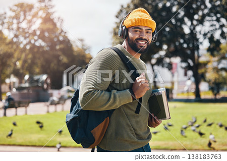 Student, headphones and backpack for outdoor education, college or university podcast in park or campus. Portrait of african man walking, travel and books with study, learning and listening to music Student, headphones and backpack for outdoor education, college or university podcast in park or campus. Portrait of african man walking, travel and books with study, learning and listening to music 138183763
