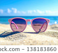 Summer holidays and travel. Stylish pink sunglasses on a sandy beach. Romantic style. 138183860
