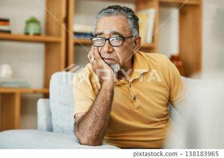 Face, mental health and thinking with a sad old man on a sofa in the living room of his retirement home. Depression, alzheimer or dementia and a senior person looking lonely with memory nostalgia Face, mental health and thinking with a sad old man on a sofa in the living room of his retirement home. Depression, alzheimer or dementia and a senior person looking lonely with memory nostalgia 138183965