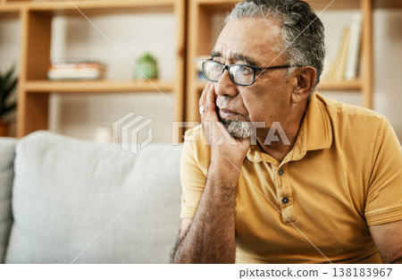 Face, depression and thinking with a sad old man on a sofa in the living room of his retirement home. Mental health, alzheimer or dementia and a senior person looking lonely with memory nostalgia 138183967