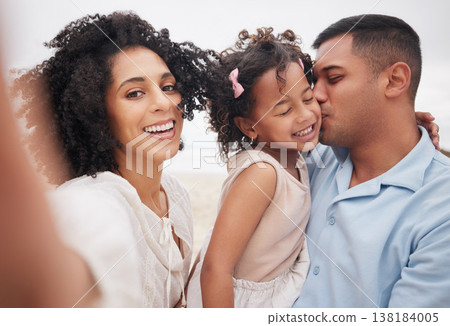 Selfie, portrait and a family at the beach with a kiss, bonding or fun on a vacation. Happy, travel and a mother, father and girl kid taking a photo at the ocean for summer freedom, love and care 138184005
