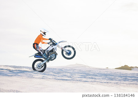 Motorbike, person and sports with training, challenge and with safety, travelling and workout with fitness. Athlete, sand and biker with mockup, practice and cycling with exercise, summer and energy 138184146