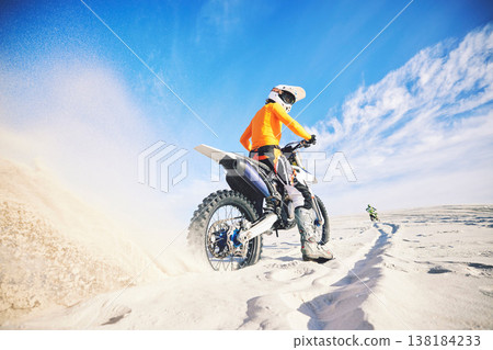 Desert dust, motorbike and man race outdoor, adventure and travel for extreme sports challenge. Off road, sand and back of driver on motorcycle on dirt in nature for action, competition and freedom Desert dust, motorbike and man race outdoor, adventure and travel for extreme sports challenge. Off road, sand and back of driver on motorcycle on dirt in nature for action, competition and freedom 138184233