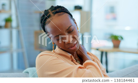 Home, neck pain and black woman on sofa with stress, muscle cramp and injury in living room. Medical accident, burnout and upset person massage shoulders for inflammation, strain and tendinitis Home, neck pain and black woman on sofa with stress, muscle cramp and injury in living room. Medical accident, burnout and upset person massage shoulders for inflammation, strain and tendinitis 138184461