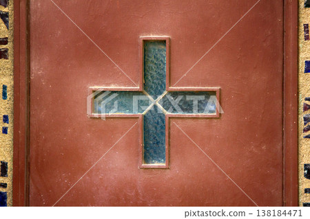 Catholic glazed Cross on the Church door 138184471