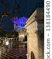 A brick warehouse lit up at night 138184490
