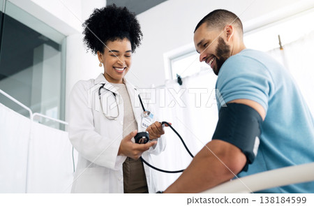Happy doctor, patient and blood pressure for appointment, checkup or visit at hospital. Medical woman, surgeon or nurse helping man, customer or client for monitoring heart rate at healthcare clinic 138184599